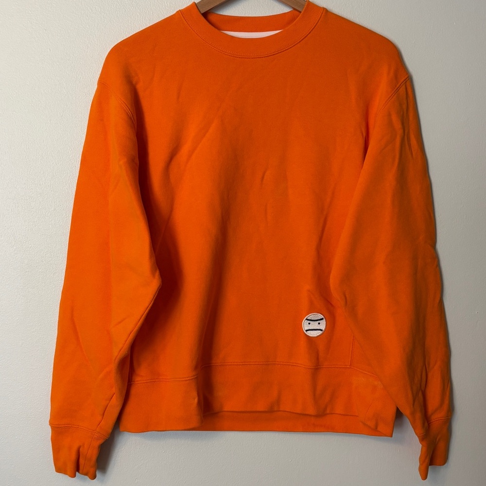 Tory Burch Sport Orange crew neck tennis sweater with Little Grumps embroidery